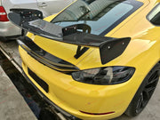 Buy Now DRY CARBON FIBER REAR WING SPOILER for PORSCHE 718 982 CAYMAN COUPE 2016 - 2025 and upgrade car parts from SIR Tuning at the Best Price. Headlights, Tail lights, Bodykits, Navigations, body kit and more - Fast & Free Shipping within Europe, US & Worldwide.