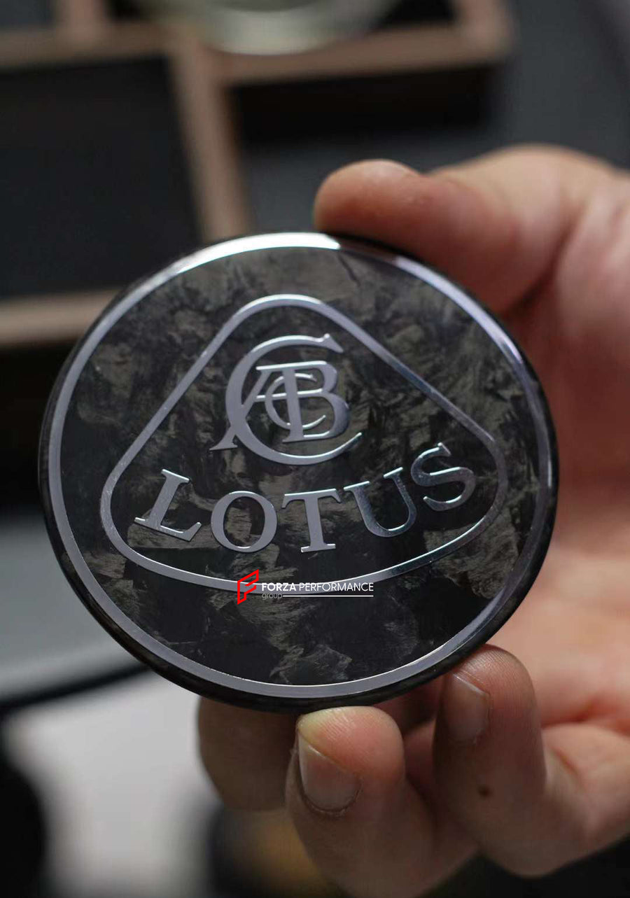 Buy Now FORGED CARBON HOOD EMBLEM LOGO for LOTUS EMIRA | ELETRE and upgrade car parts from SIR Tuning at the Best Price. Headlights, Tail lights, Bodykits, Navigations, Carbon body kit and more - Fast & Free Shipping within Europe, US & Worldwide.