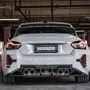 Buy Now AUTHENTIC SOOQOO DRY CARBON REAR BUMPER TRIMS for BMW M2 G87 2023+ and upgrade car parts from SIR Tuning at the Best Price. Headlights, Tail lights, Bodykits, Navigations, Carbon body kit and more - Fast & Free Shipping within Europe, US & Worldwide.