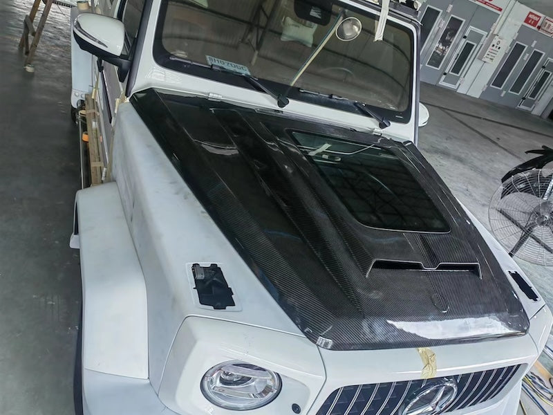 Buy Now TRANSPARENT CARBON HOOD BONNET FOR MERCEDES BENZ G CLASS W464 G400 G500 G63 2018+ and upgrade car parts from SIR Tuning at the Best Price. Headlights, Tail lights, Bodykits, Navigations, Carbon body kit and more - Fast & Free Shipping within Europe, US & Worldwide.