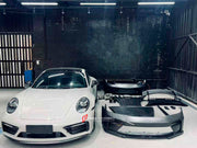 Buy Now DRY CARBON CONVERSION BODY KIT for PORSCHE 911 992.1 CARRERA 2019 - 2023 to 992.2 GT3 2025+ and upgrade car parts from SIR Tuning at the Best Price. Headlights, Tail lights, Bodykits, Navigations, Carbon body kit and more - Fast & Free Shipping within Europe, US & Worldwide.
