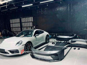 Buy Now DRY CARBON CONVERSION BODY KIT for PORSCHE 911 992.1 CARRERA 2019 - 2023 to 992.2 GT3 2025+ and upgrade car parts from SIR Tuning at the Best Price. Headlights, Tail lights, Bodykits, Navigations, Carbon body kit and more - Fast & Free Shipping within Europe, US & Worldwide.