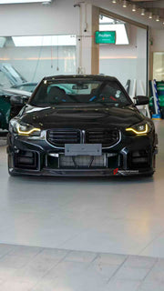 Buy Now DRY CARBON FRONT LIP FRONT BUMPER CANARDS MIRROR COVERS SIDE SKIRTS for BMW M2 G87 2023+ and upgrade car parts from SIR Tuning at the Best Price. Headlights, Tail lights, Bodykits, Navigations, Carbon body kit and more - Fast & Free Shipping within Europe, US & Worldwide.