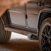 Buy Now NORLUND ELECTRIC SIDE STEP WITH EXHAUST SYSTEM for MERCEDES-BENZ G-CLASS G63 G500 W463 2018+ and upgrade car parts from SIR Tuning at the Best Price. Headlights, Tail lights, Bodykits, Navigations, Carbon body kit and more - Fast & Free Shipping within Europe, US & Worldwide.