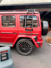 Buy Now ROOF RACK BAR LUGGAGE WITH LADDER for MERCEDES BENZ G-CLASS W465 W464 W463A G63 G550 G500 G450D 2019+ and upgrade car parts from SIR Tuning at the Best Price. Headlights, Tail lights, Bodykits, Navigations, Carbon body kit and more - Fast & Free Shipping within Europe, US & Worldwide.