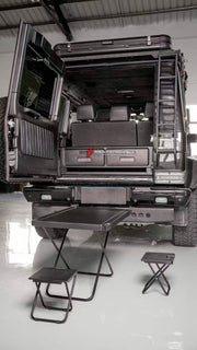 Buy Now TRUNK STORAGE with TABLE and FOLDING CHAIR for MERCEDES-BENZ G-CLASS G63 G550 G500 W465 2024+ and upgrade car parts from SIR Tuning at the Best Price. Headlights, Tail lights, Bodykits, Navigations, Carbon body kit and more - Fast & Free Shipping within Europe, US & Worldwide.